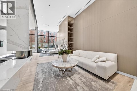 A modern living room with a white sofa and a coffee table.