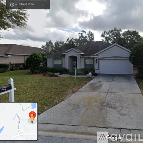 A street view image of a house with a Google map overlay.