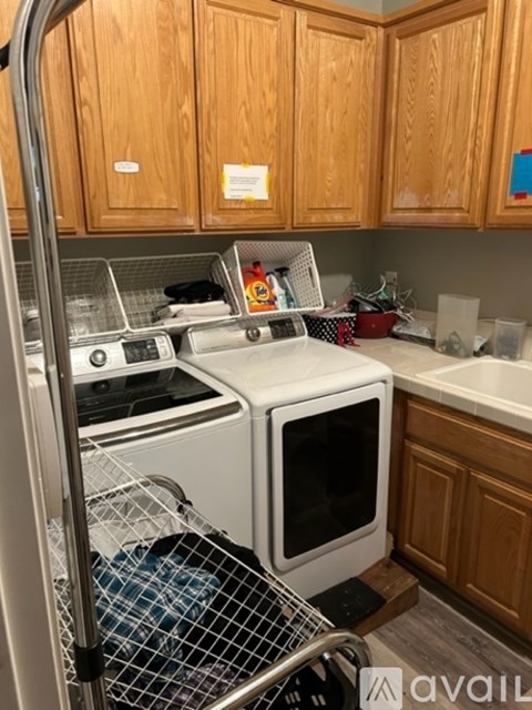 A kitchen with wooden cabinets and a white oven.