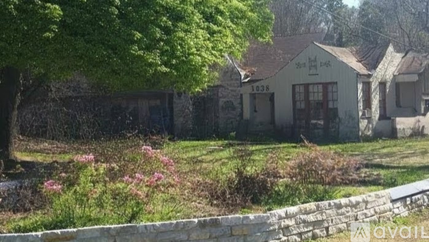 A house with the number 1038 on it is surrounded by greenery.