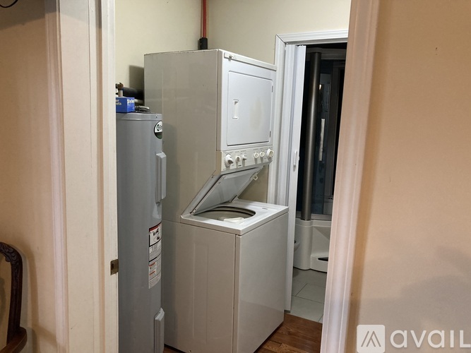A large metal appliance with a white door is in a room.