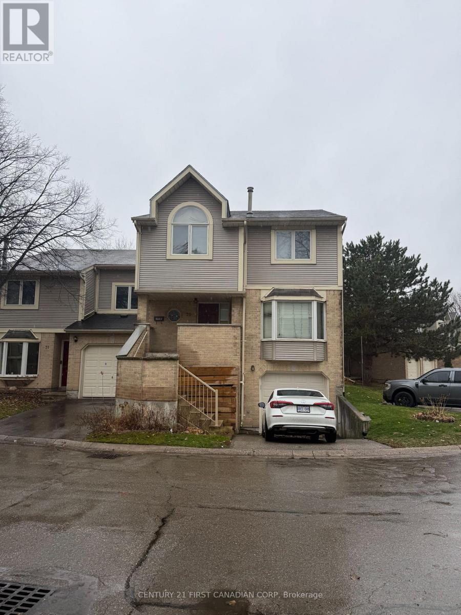 A house with a car parked in front of it.
