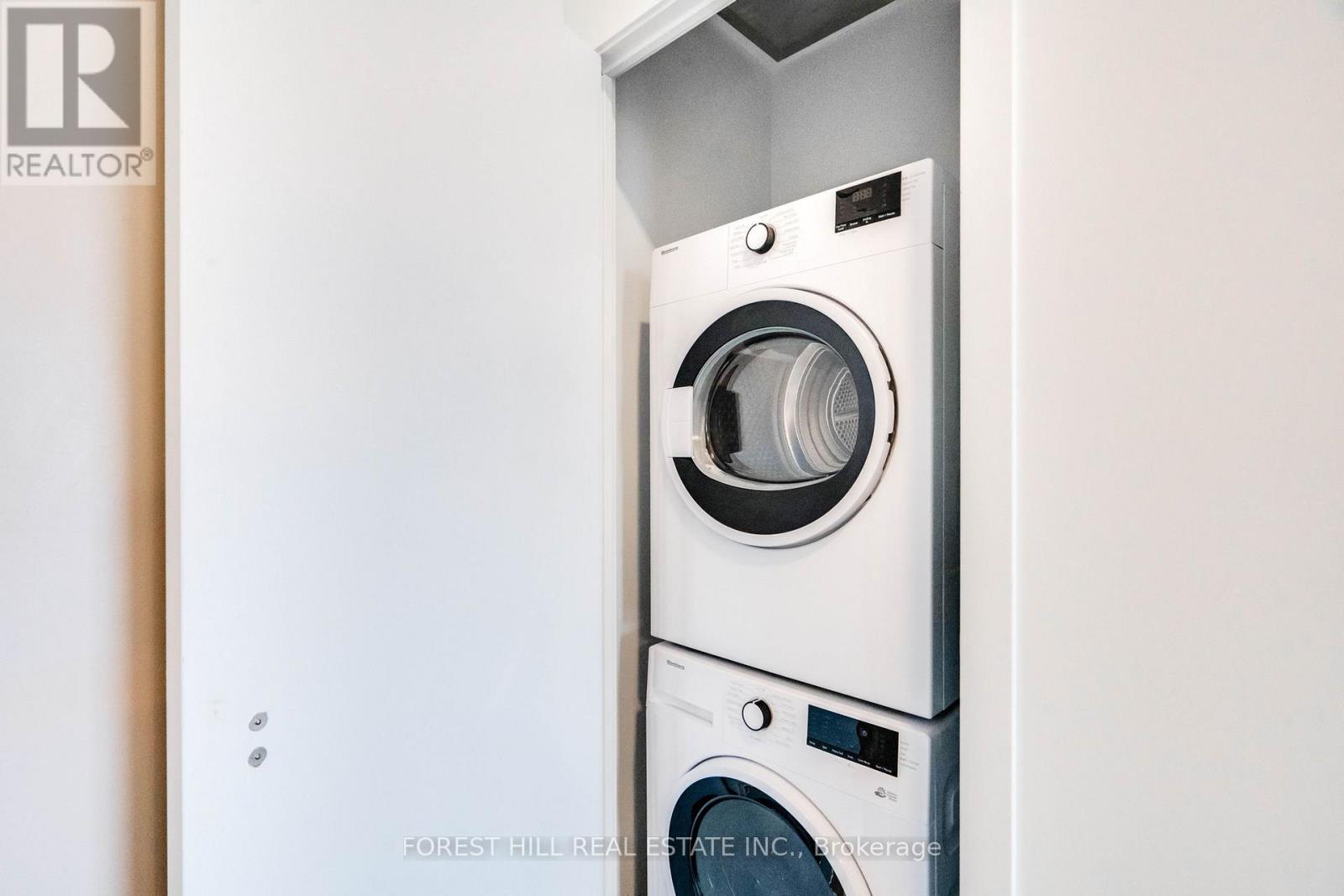 A washer and dryer stacked on top of each other in a small space.