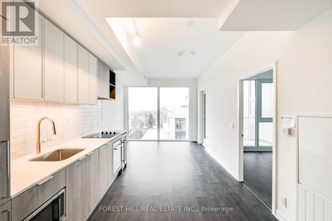A modern kitchen with a sink and cabinets.