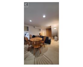 A room with a table and chairs in it.