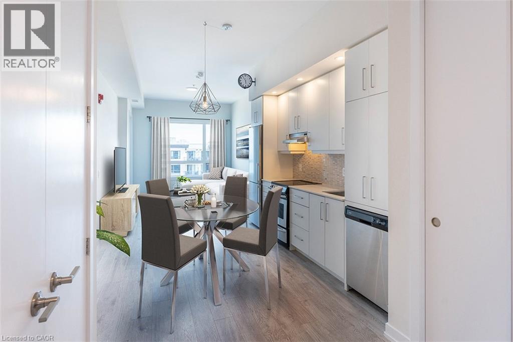A modern kitchen with a dining table set for four.
