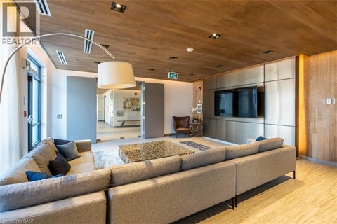 A modern living room with a long couch and a television.