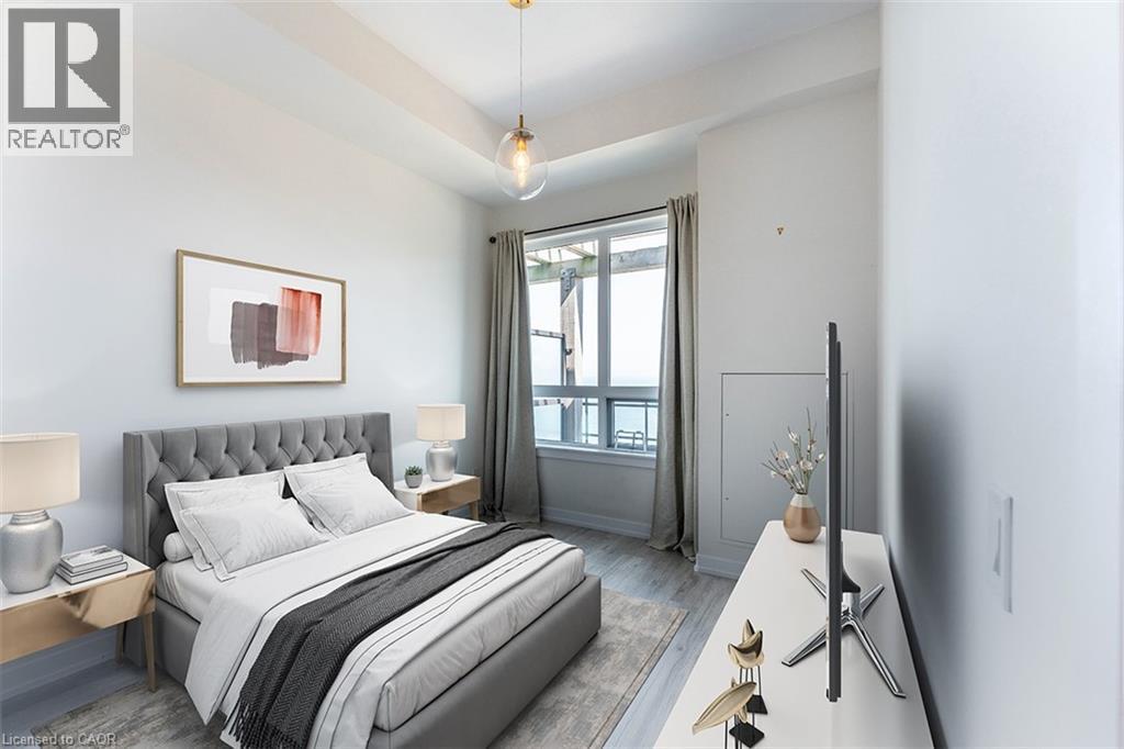 A bedroom with a large bed and a painting on the wall.