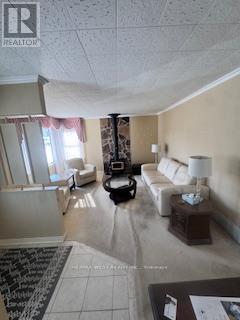 A living room with a white couch and a coffee table.