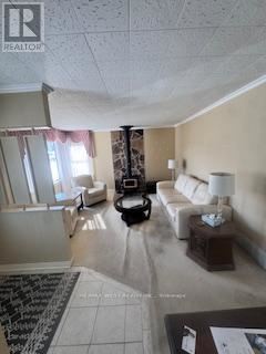 A living room with a white couch and a coffee table.