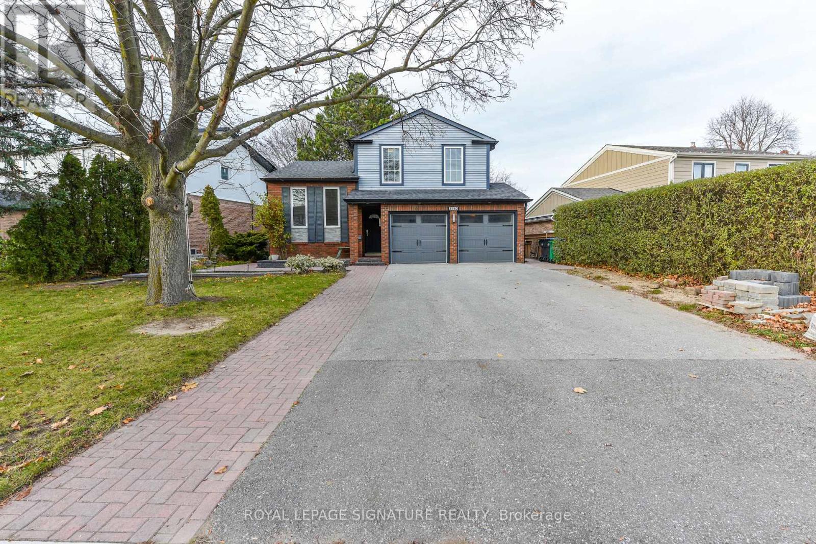A house with a driveway in front of it.