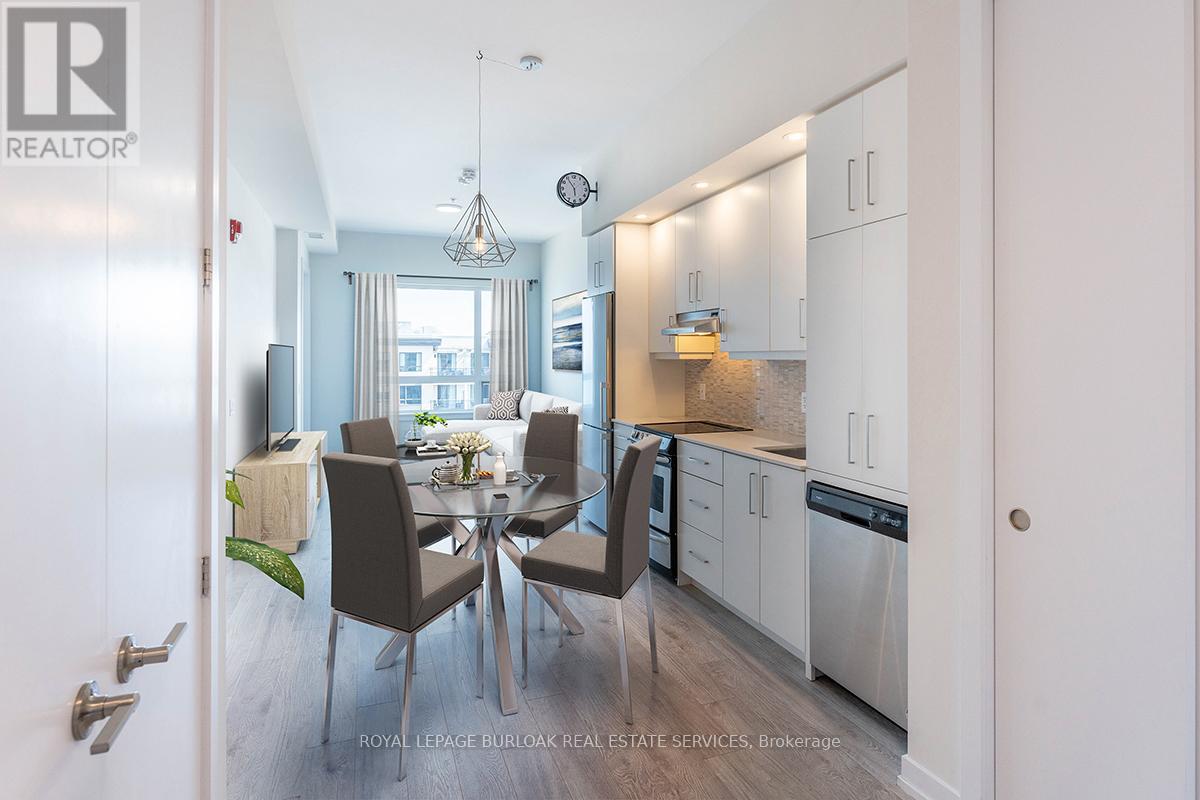 A modern kitchen with a dining table set for four.
