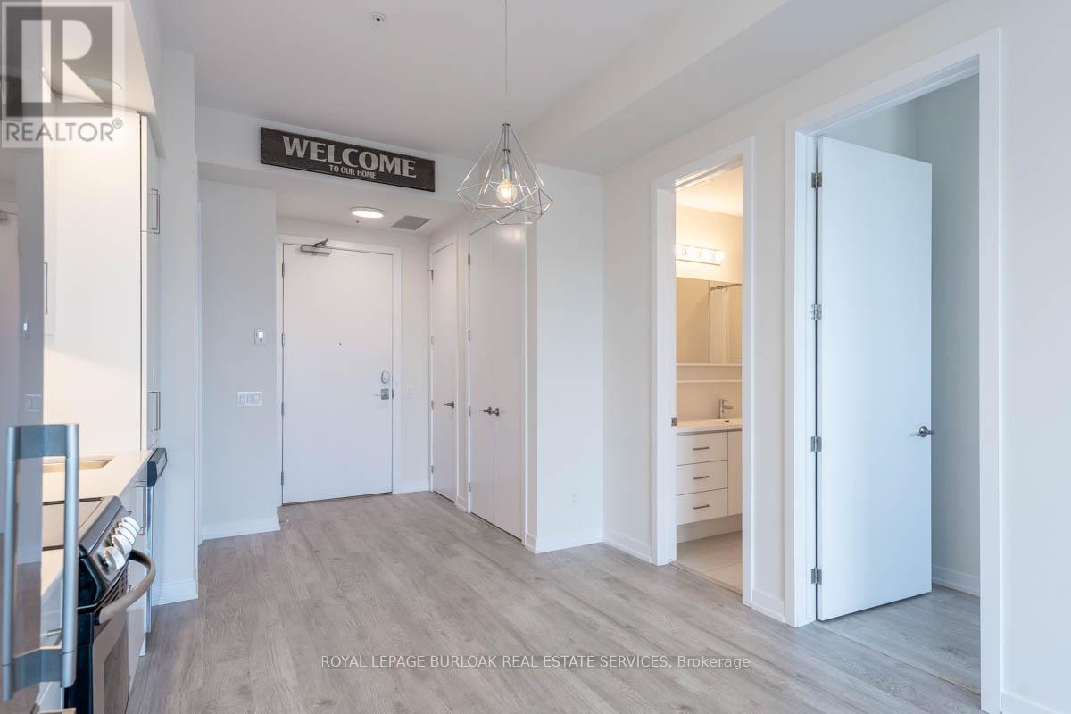 A spacious room with a "Welcome" sign on the wall.
