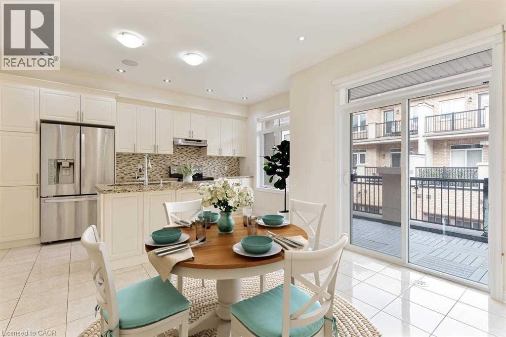 A dining room with a table set for two and a view of a balcony.