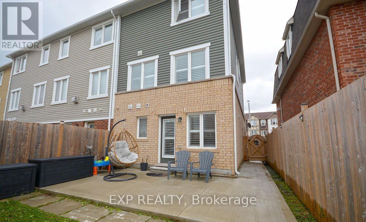 A house with a grey and brown exterior is for sale.