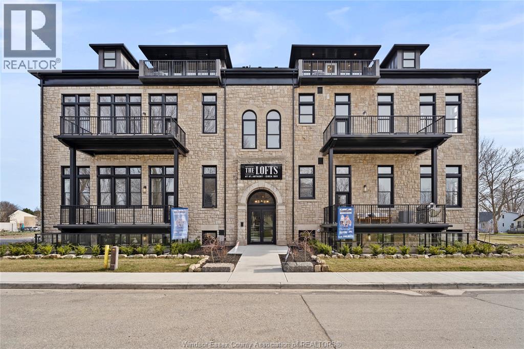 A building with the sign "The Lofts" in front of it.