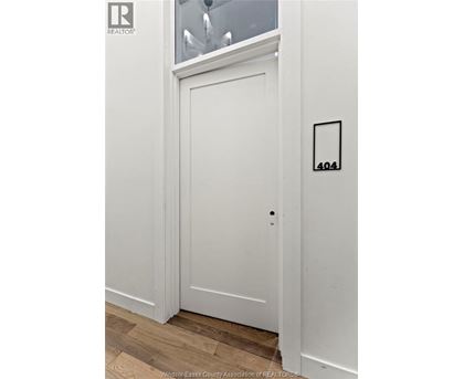A white door with a number 404 on it.