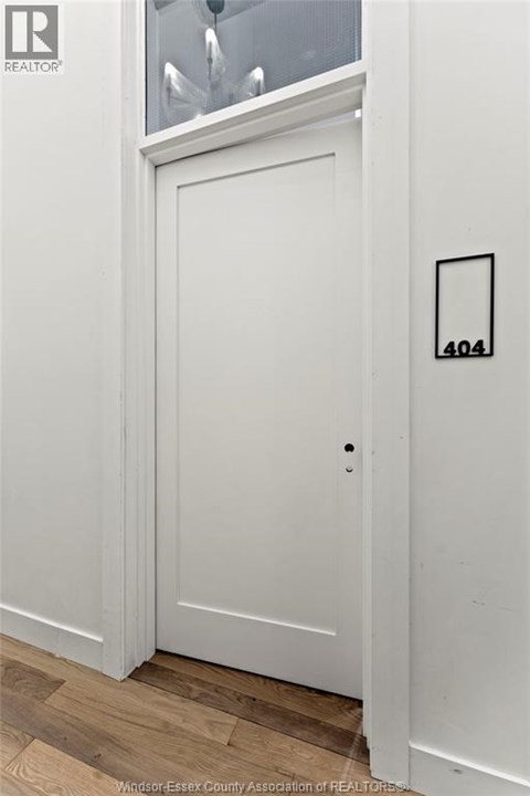 A white door with a number 404 on it.