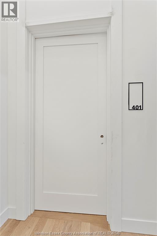 A white door with a number 401 on the wall next to it.