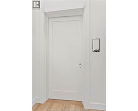 A white door with a number 401 on the wall next to it.