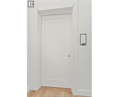 A white door with a number 401 on the wall next to it.