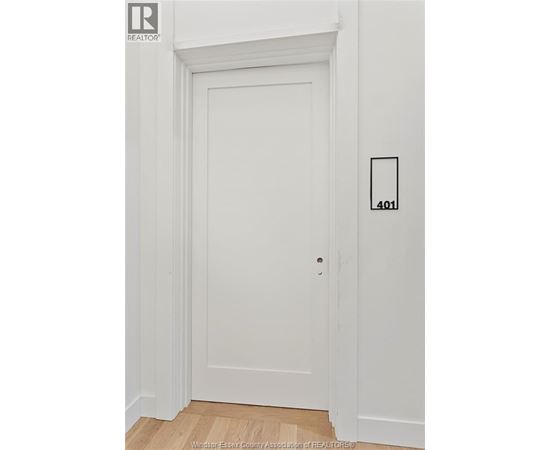 A white door with a number 401 on the wall next to it.