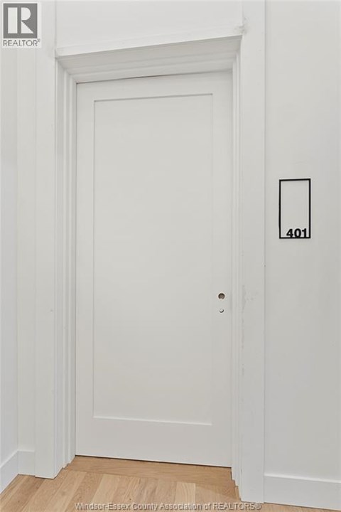 A white door with a number 401 on the wall next to it.