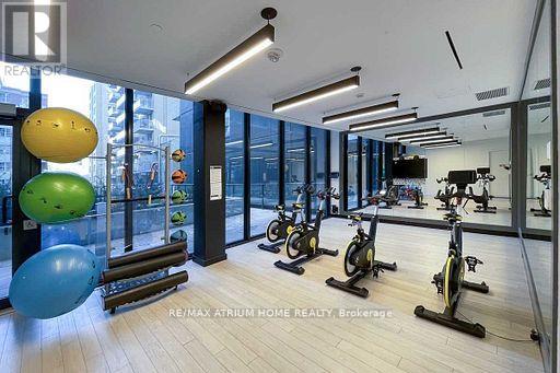 A gym with exercise bikes and exercise balls.