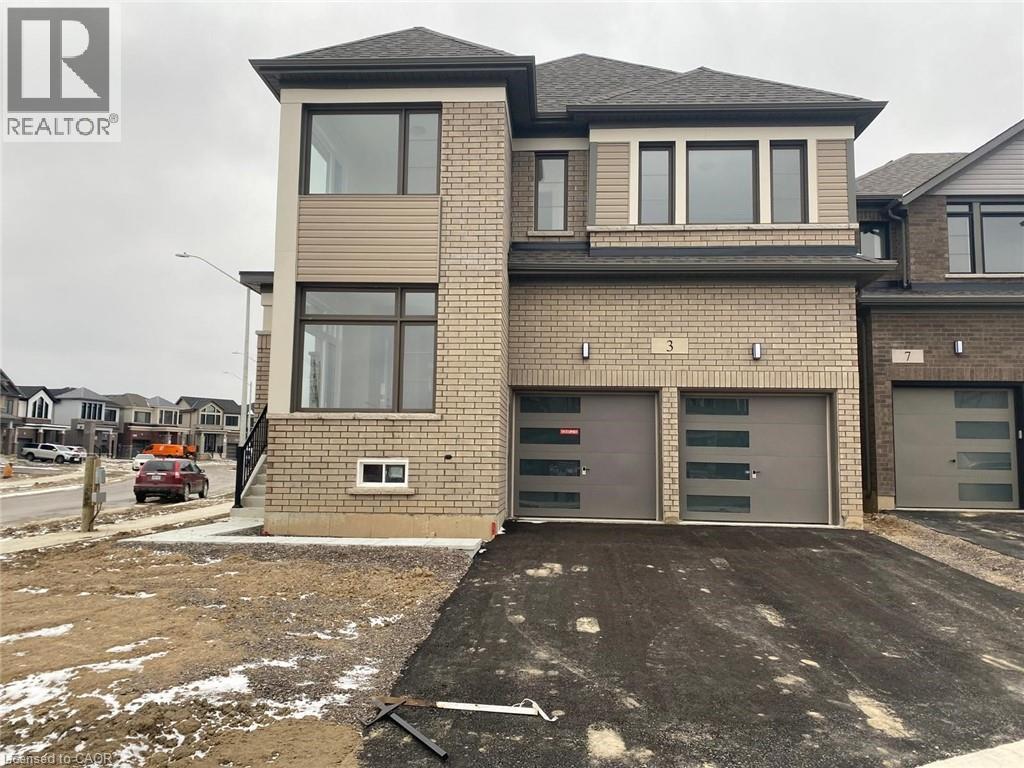 A two-story house with a garage is for sale.