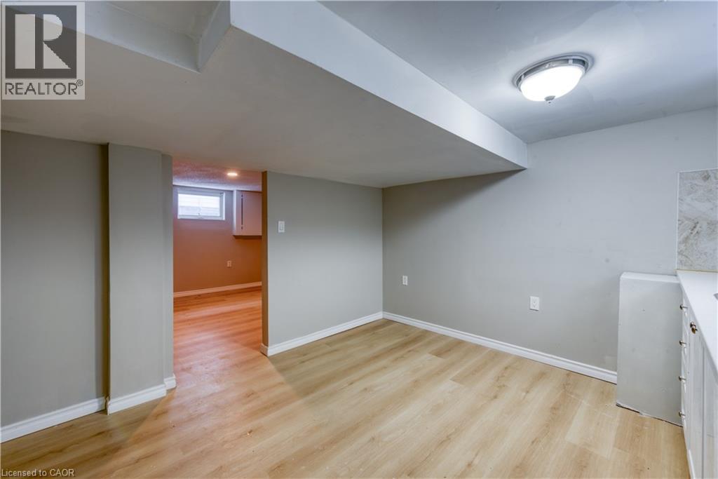 A room with wooden floors and a skylight.