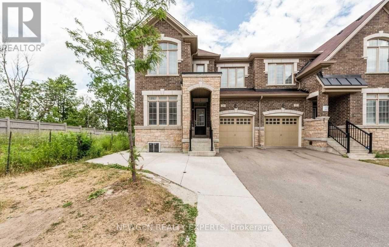 A large house with a driveway in front of it.
