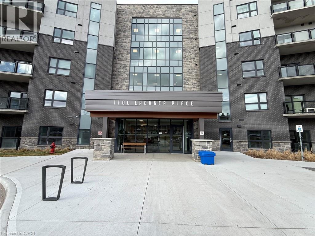 A large building with a sign that reads "1100 Lackner Place" in front of it.