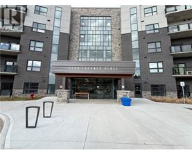 A large building with a sign that reads "1100 Lackner Place" in front of it.