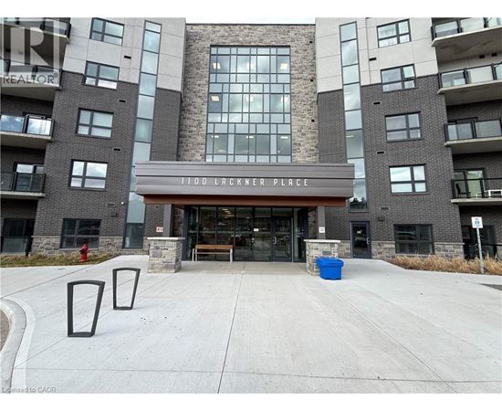 A large building with a sign that reads "1100 Lackner Place" in front of it.