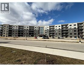 A large apartment complex with a REALTOR® logo in the corner.