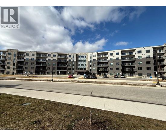 A large apartment complex with a REALTOR® logo in the corner.