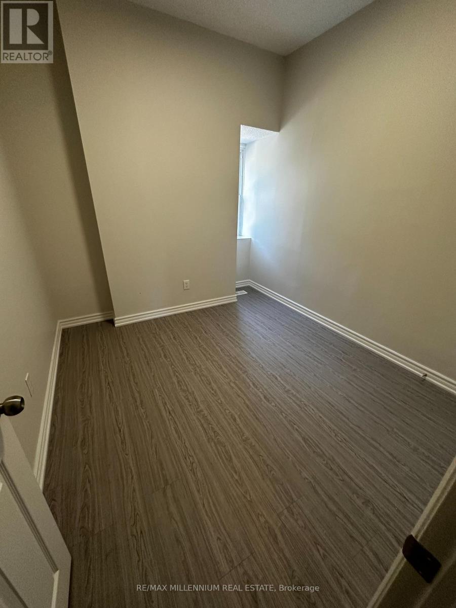 A room with a wooden floor and white walls.