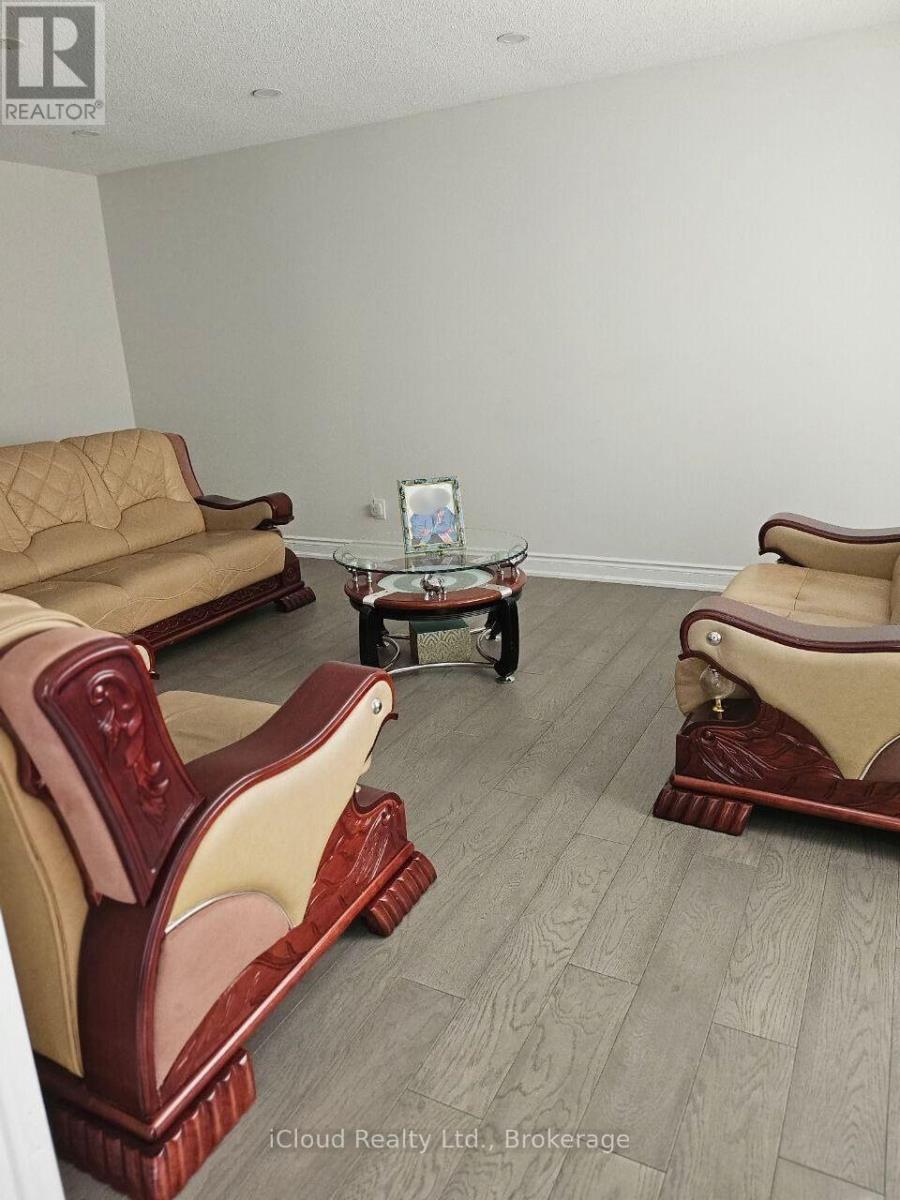 A living room with a sofa, chair, and coffee table.