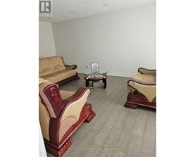 A living room with a sofa, chair, and coffee table.
