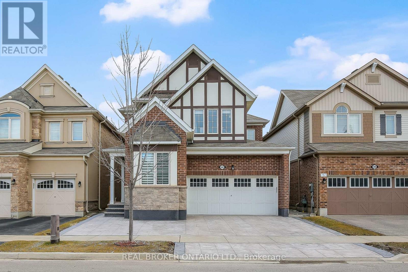 A large house with a garage is for sale.