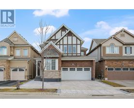 A large house with a garage is for sale.