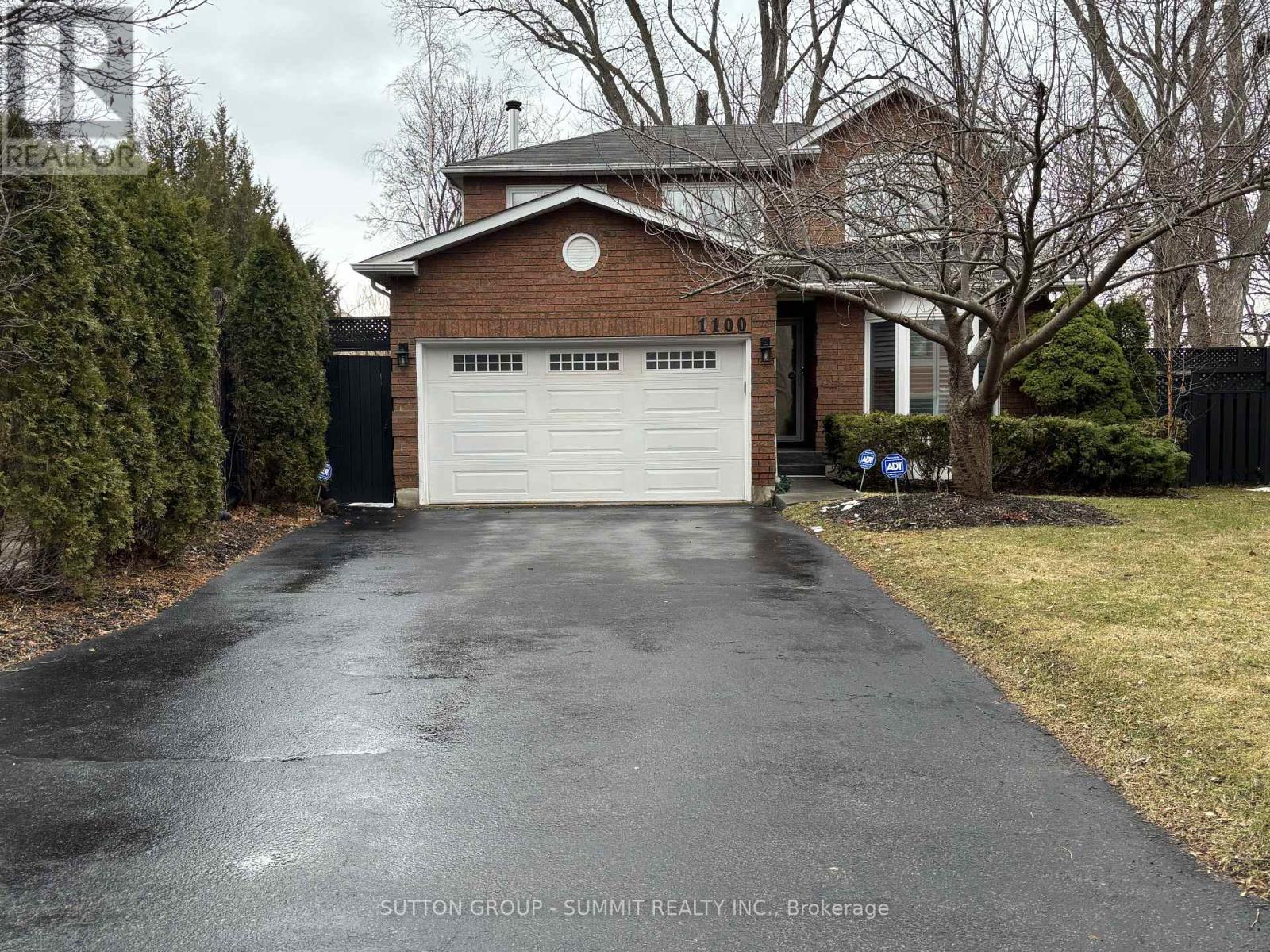 A house with a driveway in front of it.