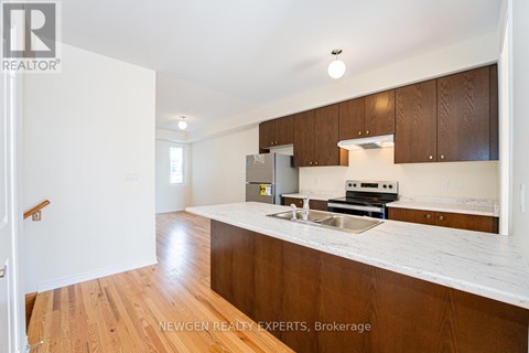 A kitchen with wooden cabinets and a white counter top.