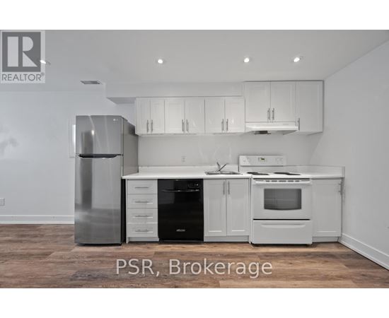 A kitchen with white appliances and cabinets.