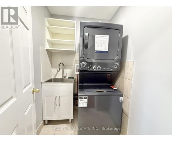 A small kitchen with a sink and a microwave.