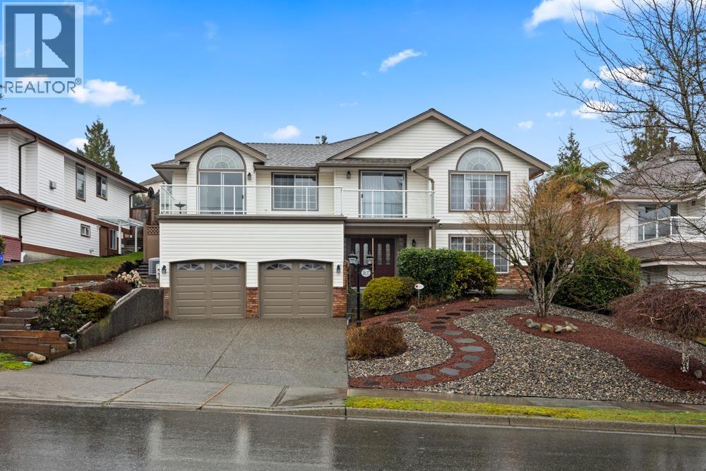 A large house with a driveway and a garage.
