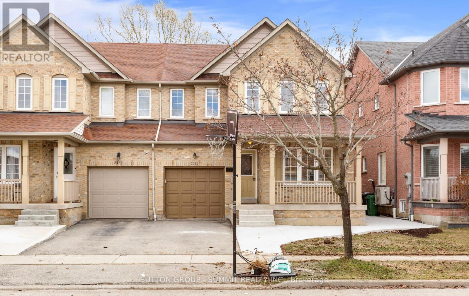 A house with a brown garage door is for sale.