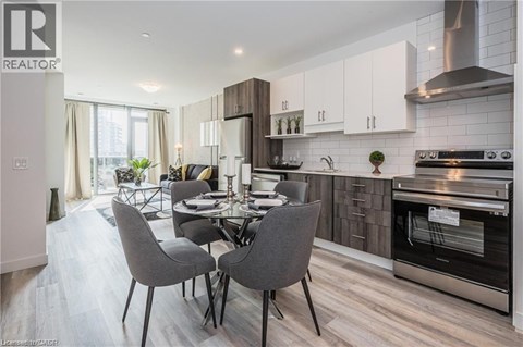 A modern kitchen with a dining table set for four.
