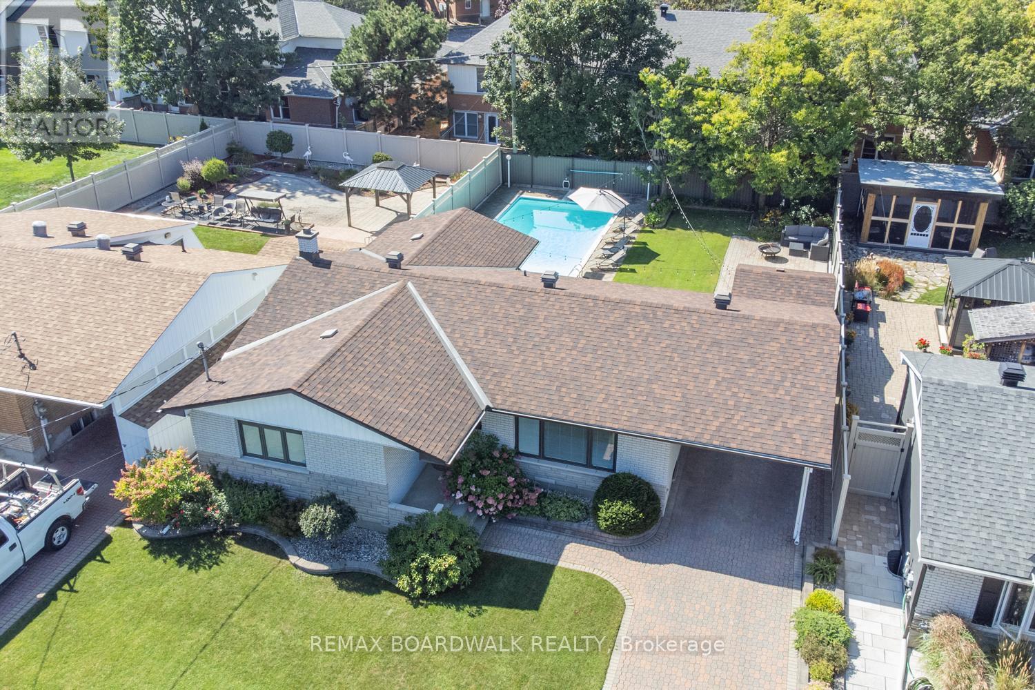 A house with a pool in the backyard.