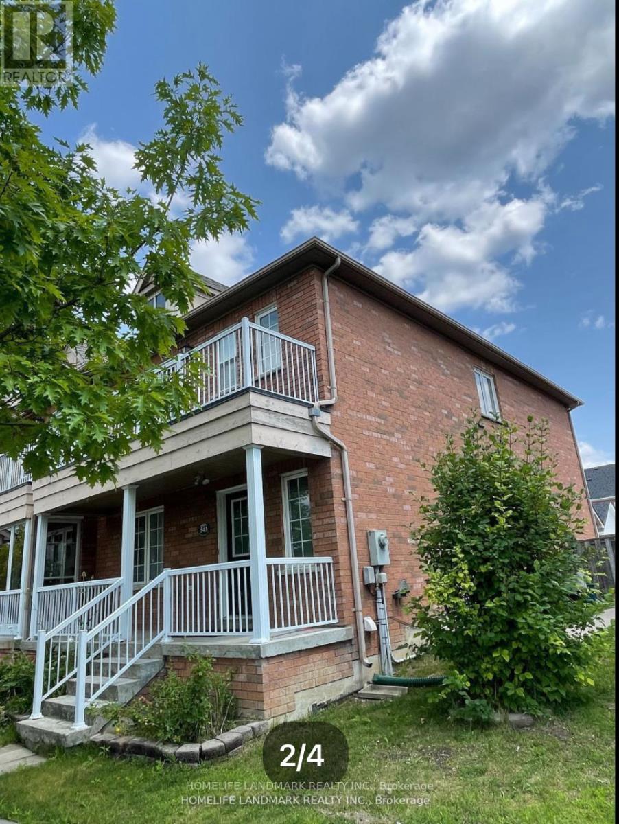 A house with a red brick exterior and a white porch.